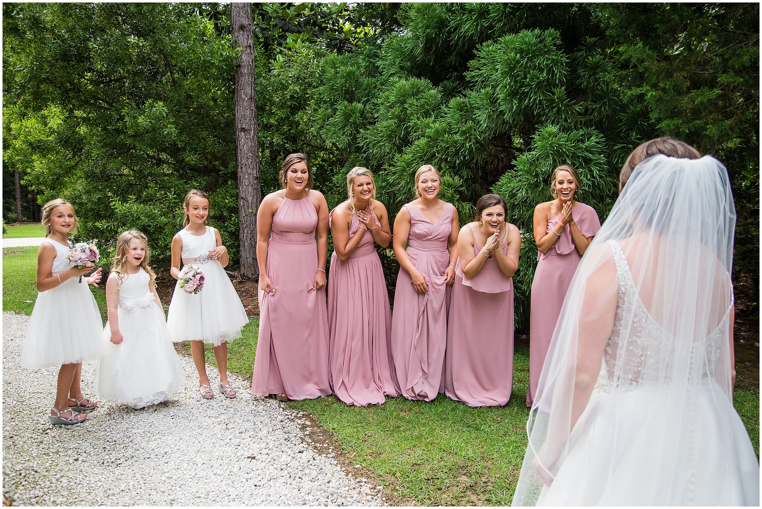 bridesmaids reacting to seeing bride in her gown and veil at bella sera gardens for photography and videography
