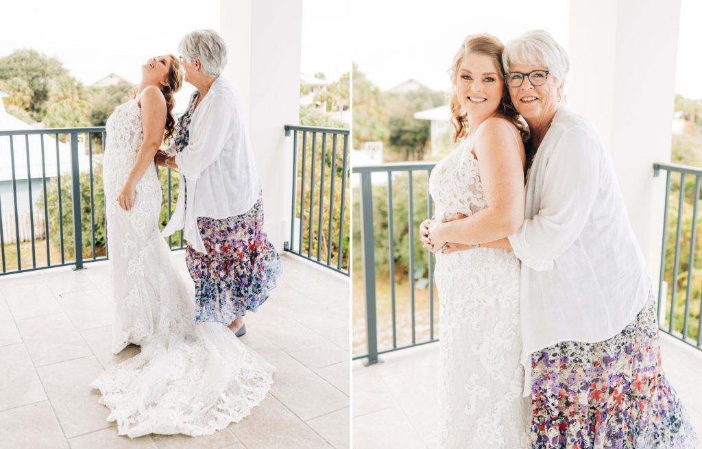 Bride and her mother get her wedding gown on and pose for a portrait
