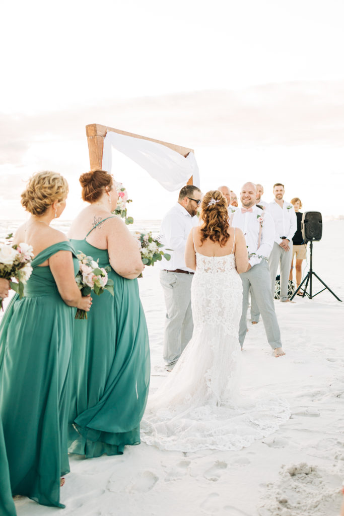 wedding party stands for ceremony on Miramar Beach Florida